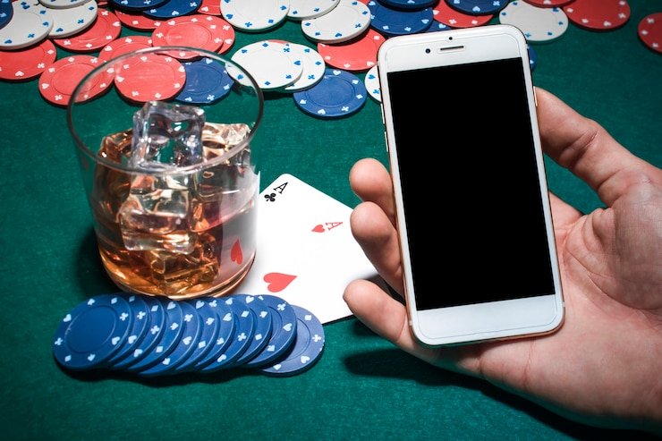 Mobile phone displaying Ocean King controls and account balance on alexit togel